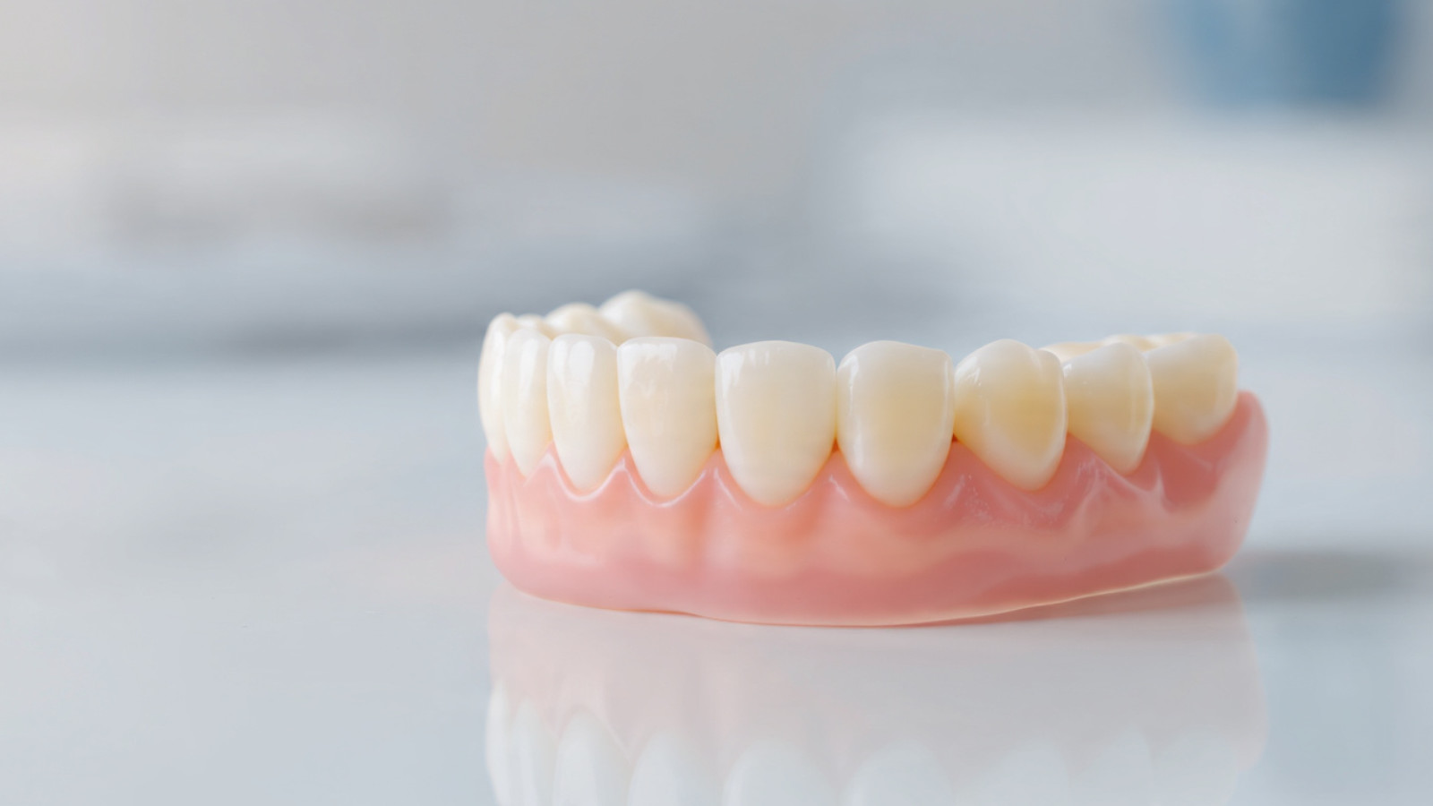 High-quality custom dentures resting on a dental model